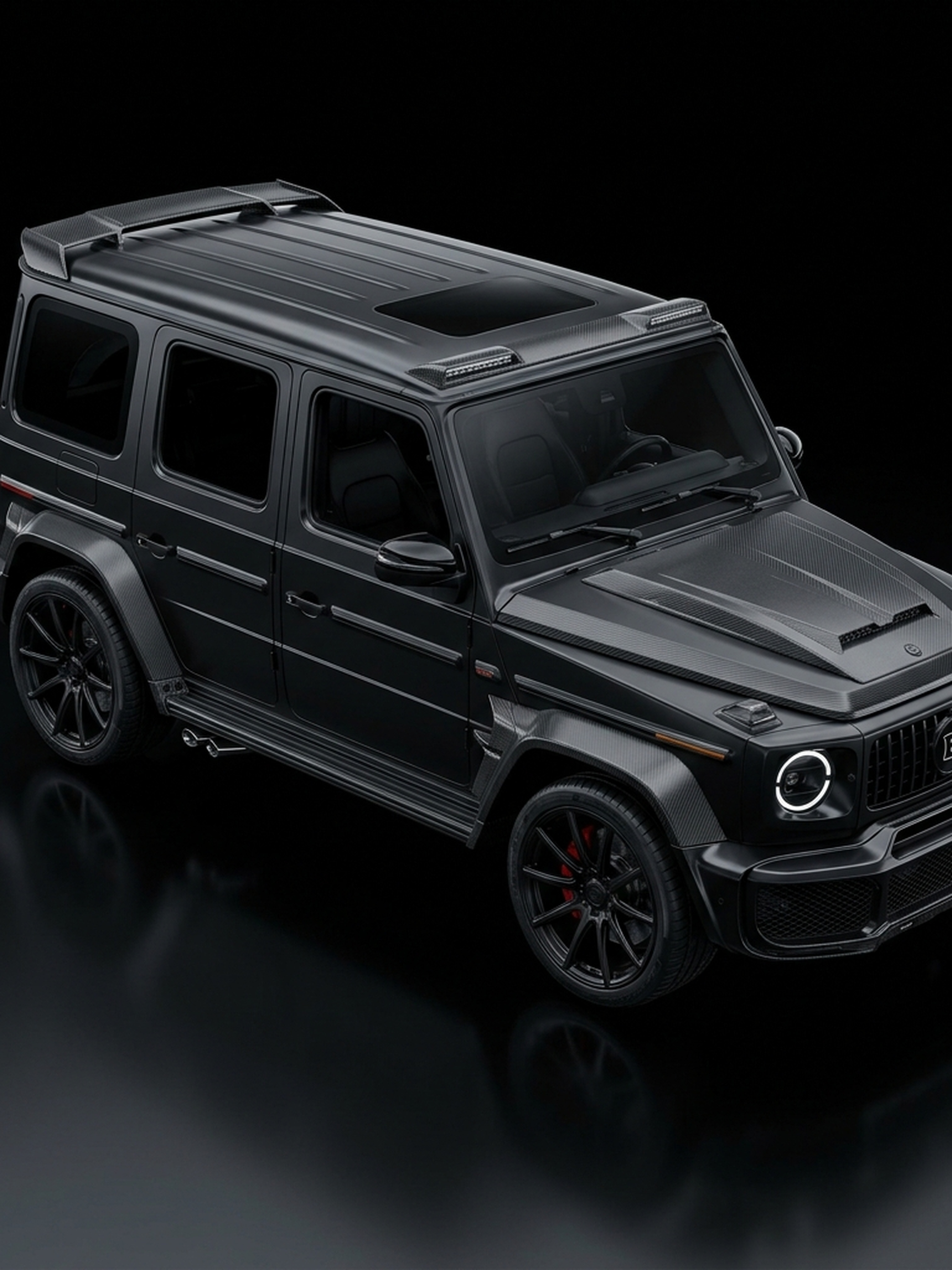 A custom Branders Mercedes G63 interior with brown leather and carbon fiber steering wheel details.