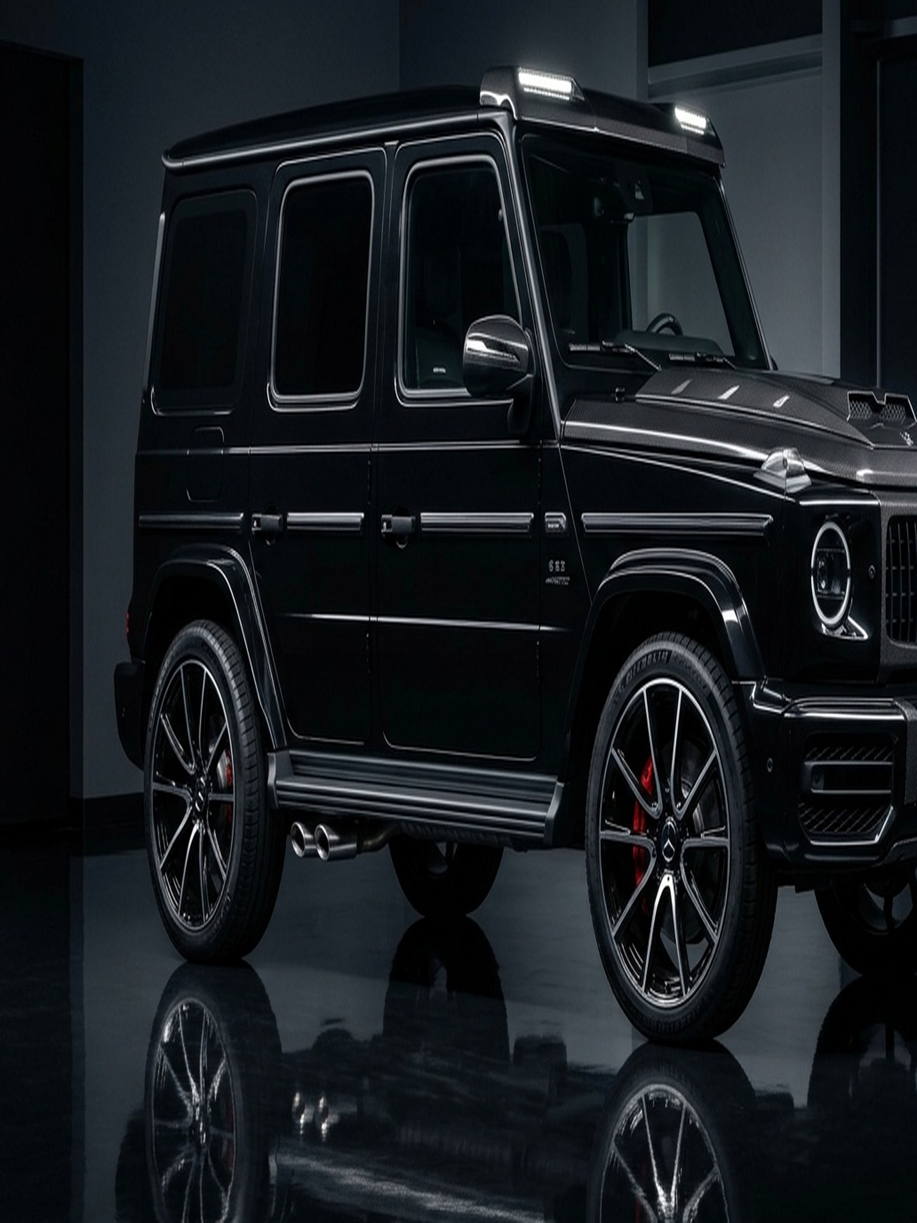 A custom Branders Mercedes G63 parked outside on concrete under a cloudy sky.