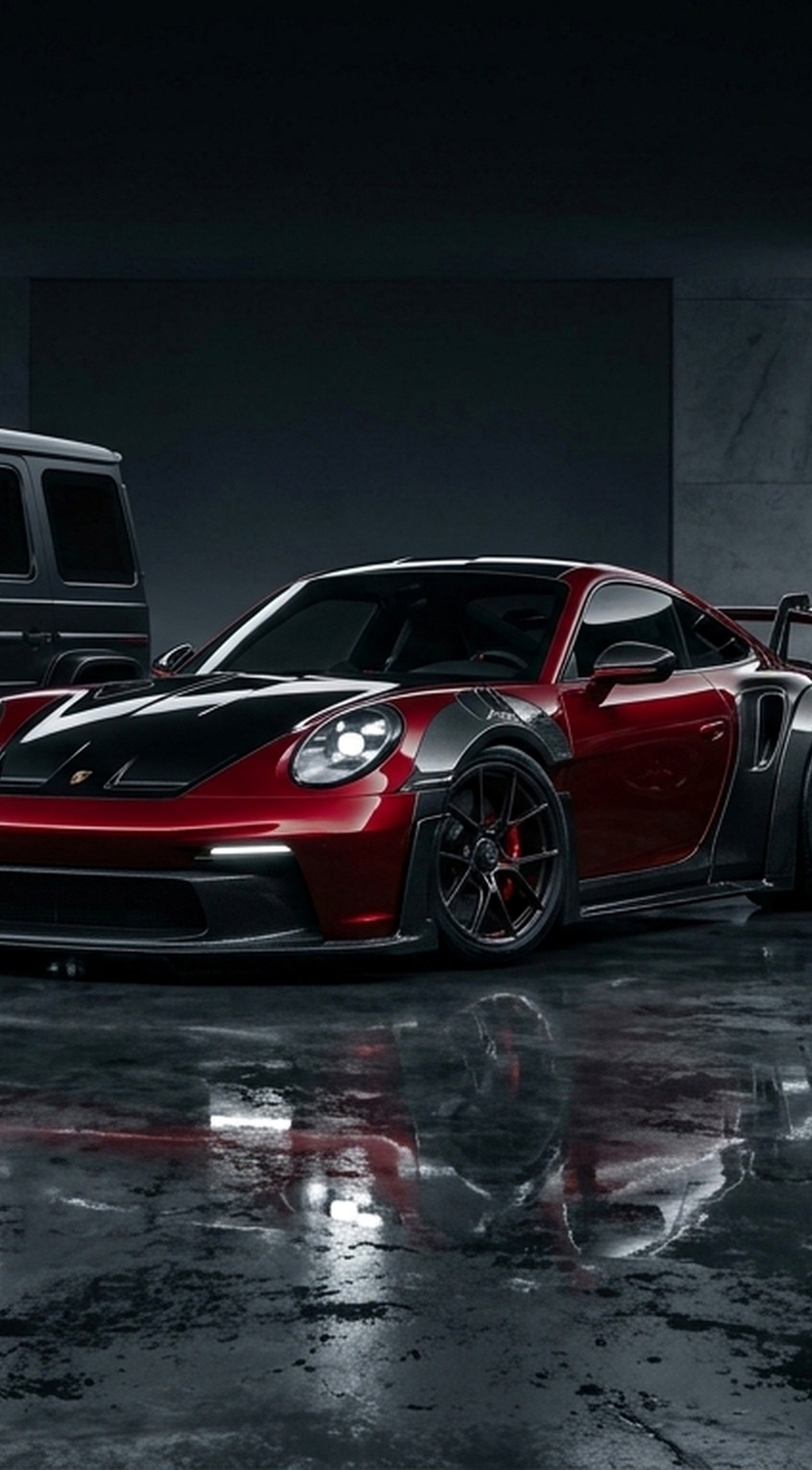 Three custom Branders vehicles, a black Mercedes G-Wagen, a red Porsche 911 GT3, and a black Land Rover Defender, are parked on a dark surface.