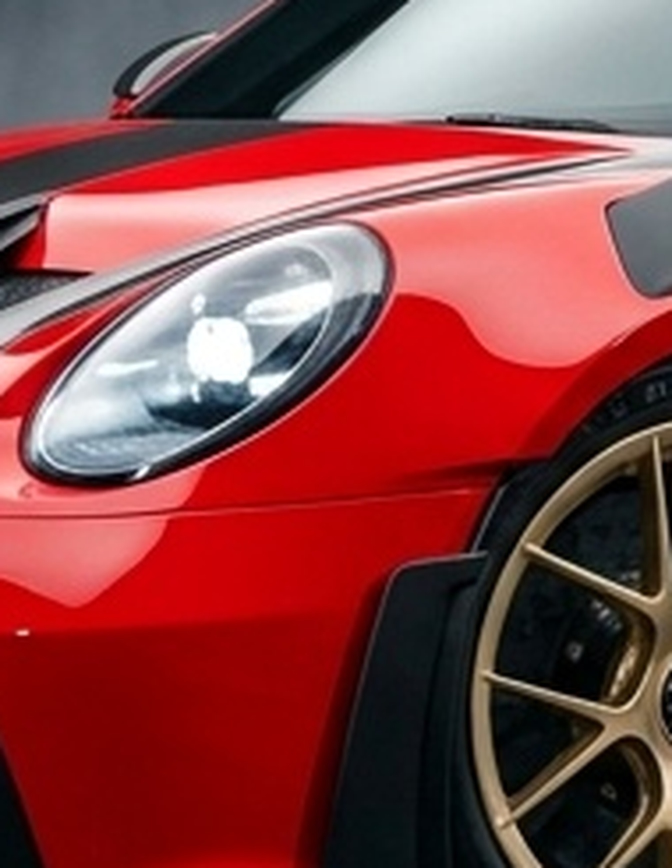 A custom Branders Porsche 911 Carrera Turbo, matte black with glossy black wheels and drilled brake rotors, is parked on a wet surface.